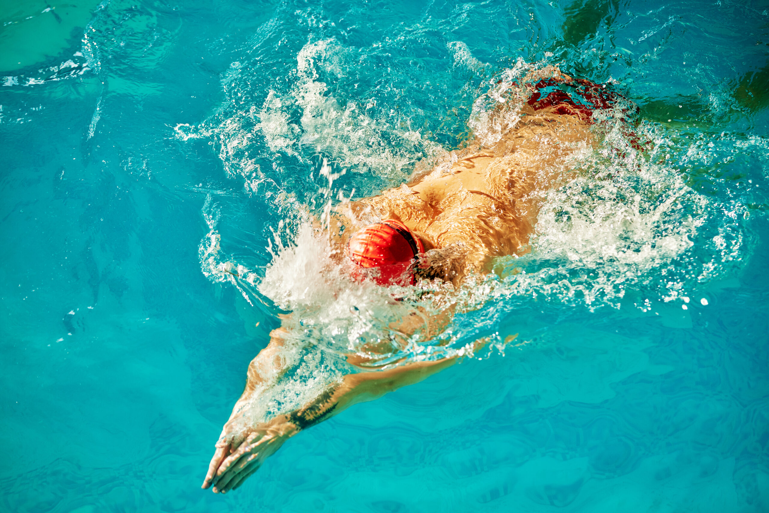 Aerial view of swimmer — the human body in water, seen from above